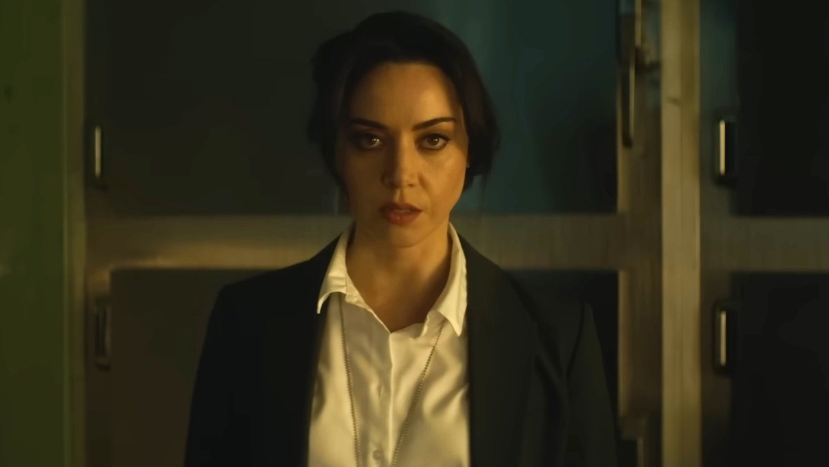 Aubrey Plaza dressed as a cop in a morgue on Agatha All Along