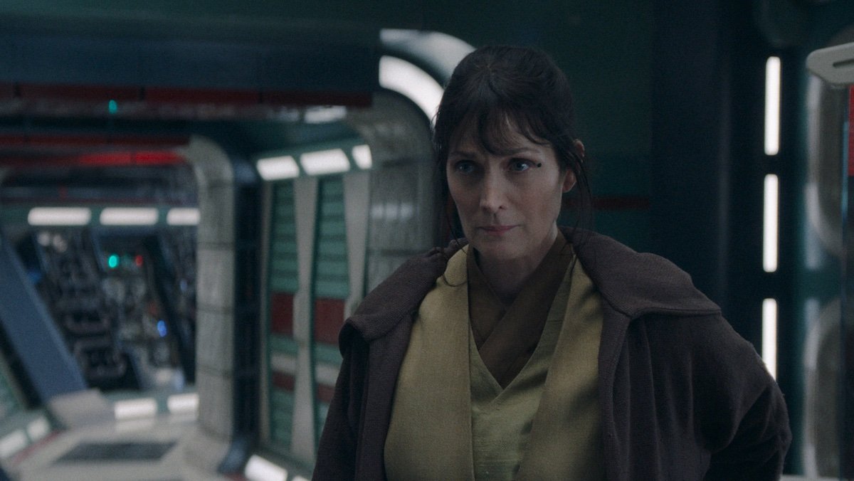 Indara looks worried on a ship on The Acolyte