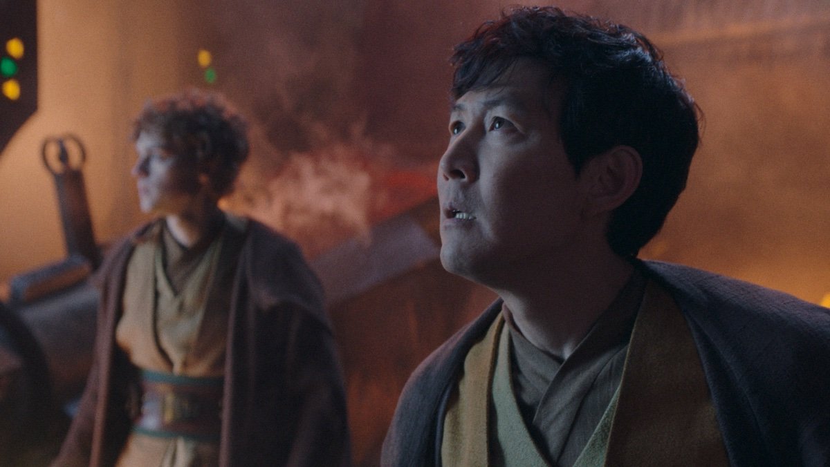 Sol and Torbin look up as a fire rages on The Acolyte
